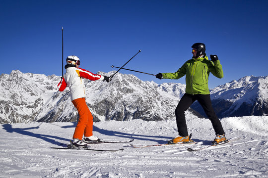 father and daughter enjoying winter sports in Solden, Austria