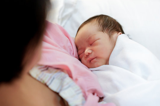 Asian Mother With Newborn Baby In The Hospital