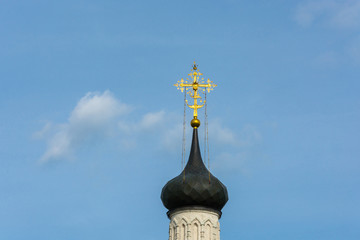 Beautiful Church dome in the background of the cloudy sky.