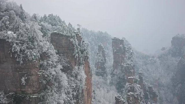 winter time chinese mountain park zhangjiajie full hd snowy panorama china
