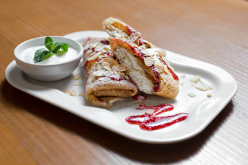 pancakes with cottage cheese on wooden table