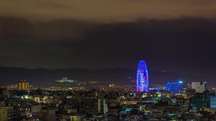 barcelona night illumination torre agbar tower city panorama 4k time lapse spain
