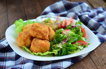 Scotch eggs and salad