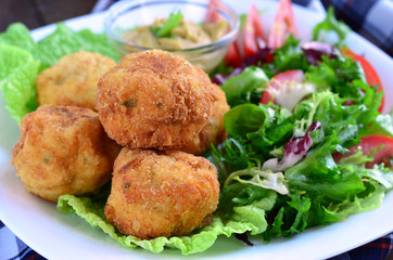 Scotch eggs and salad