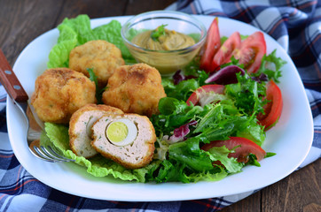 Scotch eggs and salad