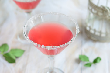 Cosmopolitan cocktail on white background