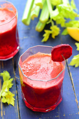 Beetroot juice on blue background