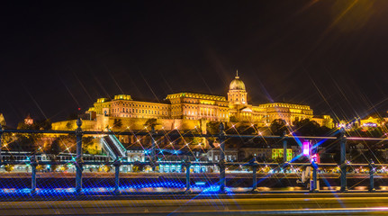 Budapest Castle at night from danube river, Hungary. Cross Filter effect