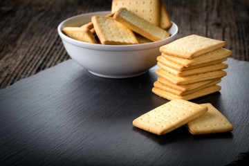 dry salted crackers in a bowl on granite plate