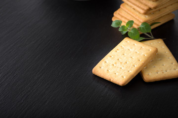 dry salted crackers on granite plate with oregano