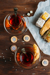Turkish sweets and tea on a dark background