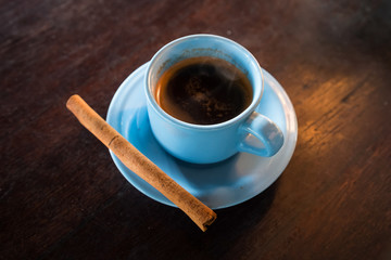 Cup of Luwak coffee with ginger stick sold in Bali,   Indonesia
