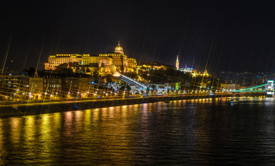 Fototapeta na wymiar Budapest Castle at night from danube river, Hungary. Cross Filter Effect