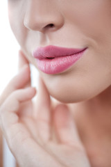 Beautiful young girl likes skincare treatment