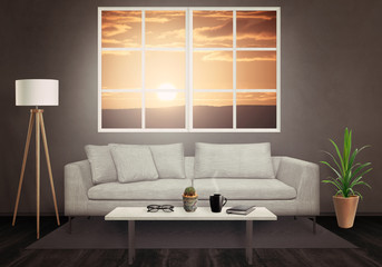 Sunset through the window in the living room. Sofa, lamp, plant, glasses, book, coffee on table in living room interior. 