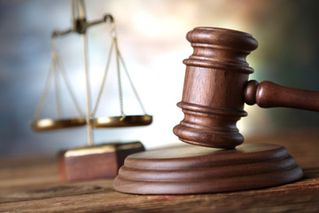 Law theme, mallet of judge, wooden gavel, books
