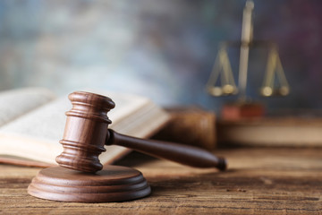 Law theme, mallet of judge, wooden gavel, books