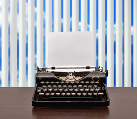 typewriter with empty paper