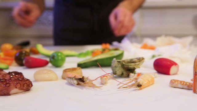 Seafood on cutting board,  cam moves to the left, closeup