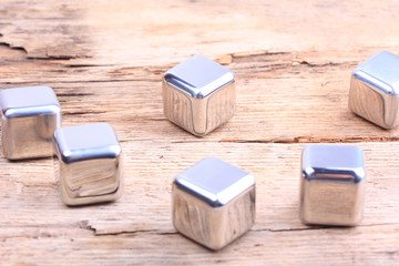 abstract background. steel cubes on a wooden surface