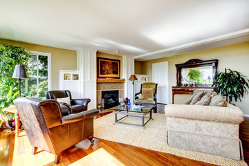 American classic living room with orange hardwood floor, large w