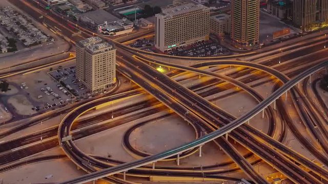 sunset night illumination traffic road junction roof top view 4k time lapse uae
