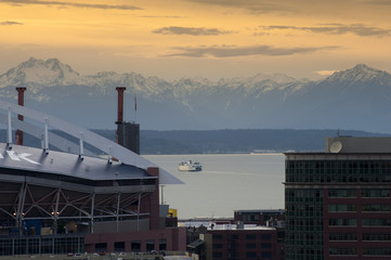 Ferry to Bainbridge Island. A ferryboat crosses Elliott Bay to the Olympic Peninsula and Bainbridge...