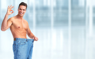 Fototapeta premium Slimming man with big size pants.