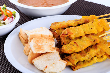 Traditional Thai style, Grilled pork satay with peanut sauce and toast.