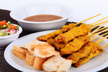 Traditional Thai style, Grilled pork satay with peanut sauce and toast.