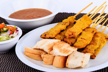 Traditional Thai style, Grilled pork satay with peanut sauce and toast.