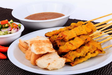 Traditional Thai style, Grilled pork satay with peanut sauce and toast.