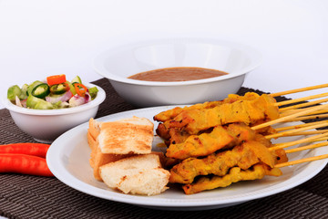Traditional Thai style, Grilled pork satay with peanut sauce and toast.