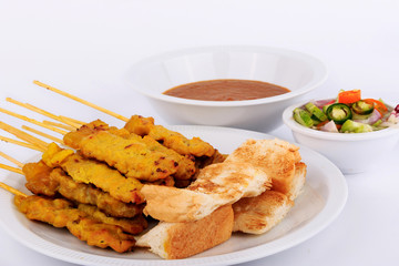 Traditional Thai style, Grilled pork satay with peanut sauce and toast.