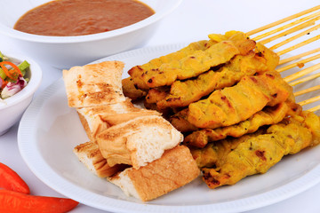 Traditional Thai style, Grilled pork satay with peanut sauce and toast.