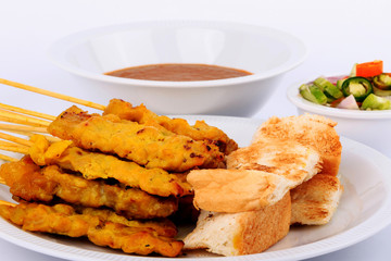 Traditional Thai style, Grilled pork satay with peanut sauce and toast.