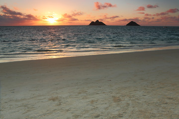 Sunrise over a beautiful white sand beach