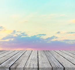 wooden floor and beautiful sunset or sunrise blurred background