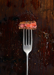 piece of steak on a fork