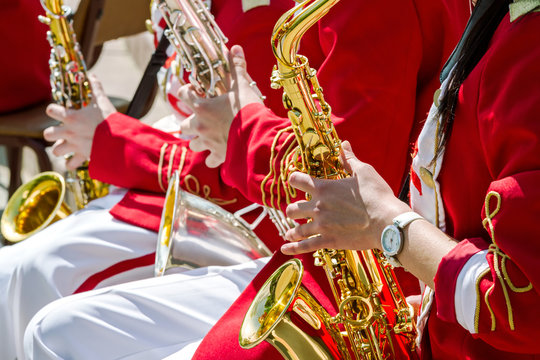 young musicians playing saxophone on the street