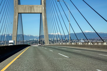 Road trip across the bridge with background of mountain view