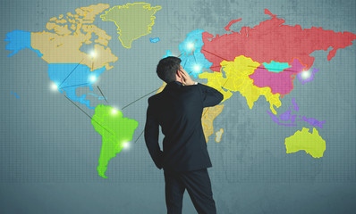 businessman drawing map on wall