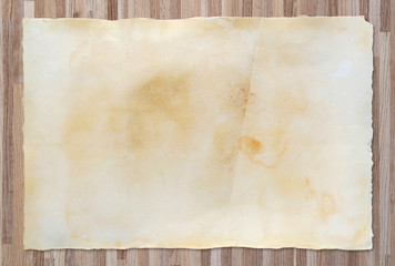Vintage paper texture on wooden background.