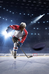Ice hockey player on the ice arena