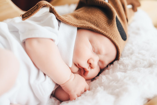 cute baby in deer hat sleeps