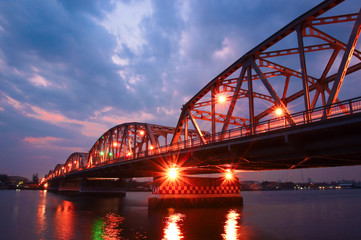 Fototapeta na wymiar Krung Thon Bridge, is a bridge over the Chao Phraya River Bangkok Thailand with sunrise