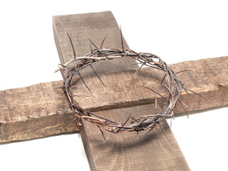 Crown of thorns on a wooden cross isolated on white
