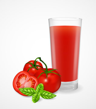 Ripe tomatoes on a branch and tomato juice in a glass.