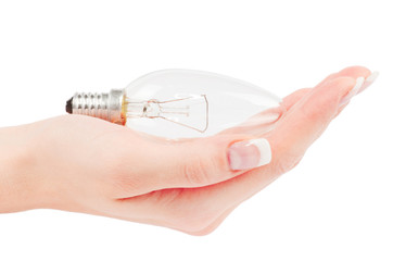 Lit lightbulb held in hand