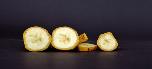 ripe banana fruit on a dark background